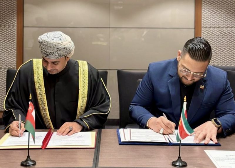 Head of Oman's Civil Aviation Authority signing agreement